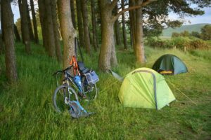 scenic camping spot with bicycle and tents